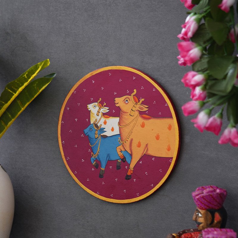 Crafted on a Wooden Plate This Pichwai Portrays Three Cows in a Circular Formation