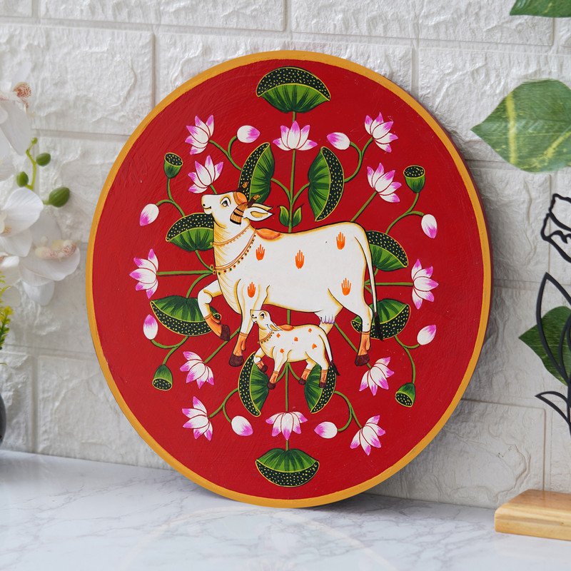 This beautiful pichwai painting features a mother cow and her calf, a timeless symbol of nurturing love.