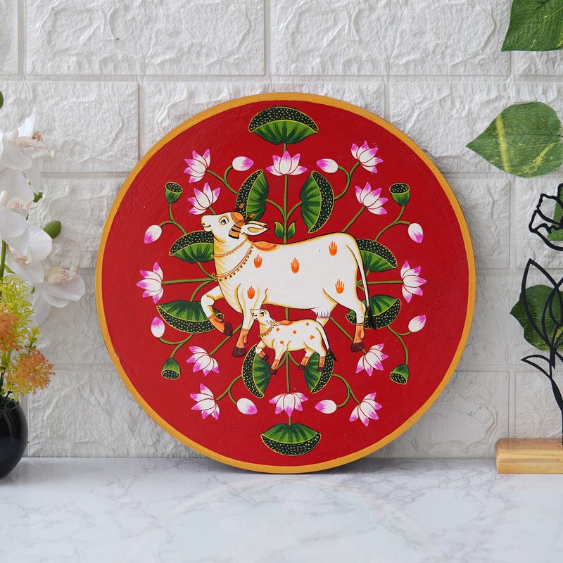 This beautiful pichwai painting features a mother cow and her calf, a timeless symbol of nurturing love.