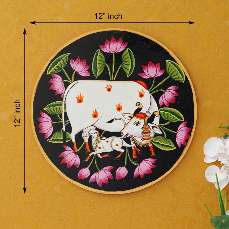 This beautiful pichwai painting features the Hindu deity Krishna cradling his beloved calf, surrounded by a vibrant array of flowers.