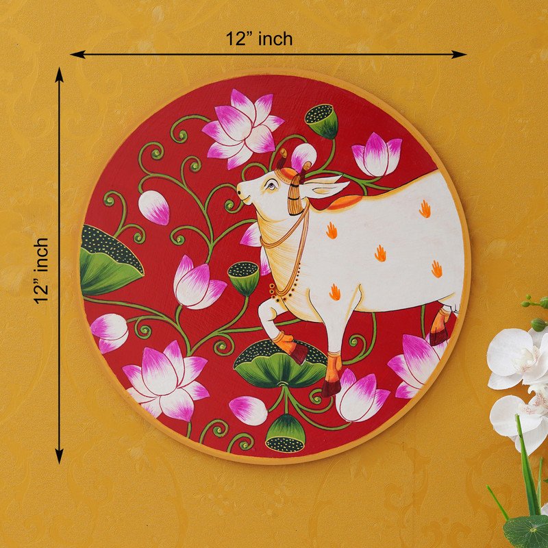 This beautiful pichwai painting features a serene white cow adorned with a vibrant floral headdress.