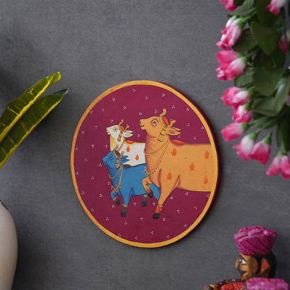 Crafted on a Wooden Plate This Pichwai Portrays Three Cows in a Circular Formation