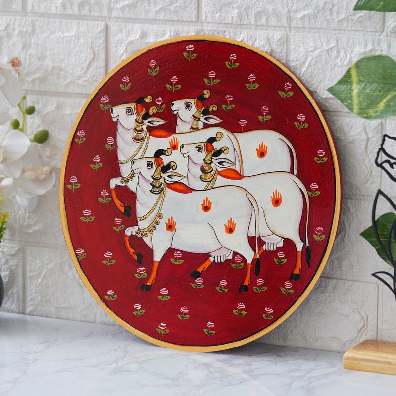 Crafted On A Red Plate This Pichwai Portrays Between A Playful Cow And A Delicate Lotus Flower