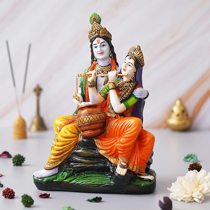 Ecraftindia Multicolor Polyresin Radha Krishna Idol Sitting on Rock Playing Flute and Holding Matki
