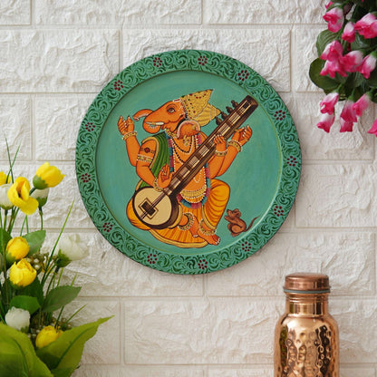 This beautiful pichwai painting features a majestic ganesh ji perched on a vibrant flowering branch.